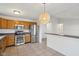 Bright kitchen features stainless steel appliances and a tile floor at 2020 Cross Willow Ln, Indianapolis, IN 46239