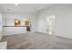 Open-concept living room with view into kitchen featuring stainless steel appliances at 2020 Cross Willow Ln, Indianapolis, IN 46239