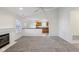 Spacious living room with fireplace and easy access to the kitchen and sunroom at 2020 Cross Willow Ln, Indianapolis, IN 46239