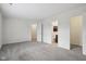 Large bedroom with carpet, multiple closets and access to en-suite bathroom at 2020 Cross Willow Ln, Indianapolis, IN 46239