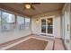 Enclosed sunroom with ceiling fan and sliding glass door that opens to interior at 2020 Cross Willow Ln, Indianapolis, IN 46239