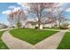 Corner lot showcasing a beautifully landscaped yard with mature trees, providing a picturesque setting in a quiet neighborhood at 2020 Cross Willow Ln, Indianapolis, IN 46239