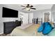 Comfortable bedroom with a large television and a view into the kitchen at 2130 Crossford Way, Indianapolis, IN 46234