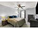 Cozy bedroom featuring a ceiling fan, neutral walls, and comfortable furnishings at 2130 Crossford Way, Indianapolis, IN 46234