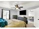 Bright bedroom with a large window, television, and view into the living room at 2130 Crossford Way, Indianapolis, IN 46234