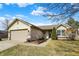 Charming single-Gathering home featuring a well-maintained lawn, attached garage, and inviting front entryway at 2130 Crossford Way, Indianapolis, IN 46234