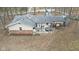 Aerial view of the backyard patio, with a hot tub, outdoor seating, and a privacy fence at 2165 Plantation Ln, Martinsville, IN 46151