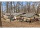 Spacious backyard with a patio, hot tub, mature trees, and outdoor seating at 2165 Plantation Ln, Martinsville, IN 46151