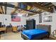 Unfinished basement featuring an exposed ceiling, concrete floor, and a finished bedroom area at 2165 Plantation Ln, Martinsville, IN 46151