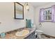 Cozy bathroom featuring a sink, mirror, toilet, window, and a decorative light fixture at 2165 Plantation Ln, Martinsville, IN 46151