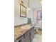 Cozy bathroom featuring a sink, mirror, toilet, window, and a decorative light fixture at 2165 Plantation Ln, Martinsville, IN 46151