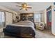 Bedroom with neutral colors and a ceiling fan, with a built-in shelf at 2165 Plantation Ln, Martinsville, IN 46151
