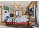 Cozy bedroom featuring a large bed, a ceiling fan, and a TV on the wall at 2165 Plantation Ln, Martinsville, IN 46151