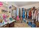 A bedroom featuring a walk-in closet, a vanity, and neutral walls at 2165 Plantation Ln, Martinsville, IN 46151