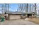 A charming single story home with a brick facade, attached garage, and a well-maintained yard at 2165 Plantation Ln, Martinsville, IN 46151