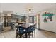 Eat-in kitchen with tile backsplash, granite countertops, and stainless steel appliances at 2165 Plantation Ln, Martinsville, IN 46151
