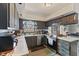 Kitchen boasts granite countertops, stainless steel appliances, and wooden cabinets at 2165 Plantation Ln, Martinsville, IN 46151