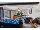 Cozy living room featuring a brick fireplace, ceiling fan, and plush carpeting at 2165 Plantation Ln, Martinsville, IN 46151