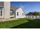 Lush backyard featuring a stone fireplace and ample space for outdoor activities at 2274 Finchley Rd, Carmel, IN 46032