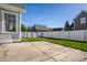 Grassy backyard with a concrete patio, and a white privacy fence perfect for outdoor enjoyment at 2274 Finchley Rd, Carmel, IN 46032