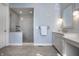 Light-filled bathroom with a glass-enclosed shower and double sink vanity at 2274 Finchley Rd, Carmel, IN 46032