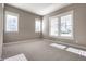 Sun-drenched bedroom with neutral paint, plush carpet, and multiple windows at 2274 Finchley Rd, Carmel, IN 46032