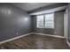 Bedroom with wood-look flooring and a large window for natural light at 2274 Finchley Rd, Carmel, IN 46032