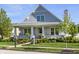 Charming two-story home with manicured lawn, stone chimney, and inviting front porch in a well-kept neighborhood at 2274 Finchley Rd, Carmel, IN 46032