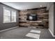Stylish living room with a plank accent wall and large window for natural lighting at 2274 Finchley Rd, Carmel, IN 46032