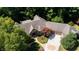 Overhead view of the home showcasing the roof, manicured landscaping, driveway, and surrounding lush greenery at 2688 S Oscar Ct, Morgantown, IN 46160