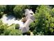 Aerial view of a large home nestled among mature trees in a serene setting at 2688 S Oscar Ct, Morgantown, IN 46160