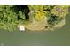 Picturesque lakefront property with mature trees and private dock for enjoying waterfront living at 2688 S Oscar Ct, Morgantown, IN 46160