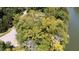Aerial view of a waterway, surrounded by lush mature trees at 2688 S Oscar Ct, Morgantown, IN 46160