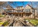 Multi-level back deck with seating, offering views of a landscaped backyard at 2688 S Oscar Ct, Morgantown, IN 46160