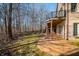 Beautiful backyard with a covered patio and lush greenery provides privacy at 2688 S Oscar Ct, Morgantown, IN 46160