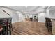 Spacious finished basement with wood-look floors, game area, and bar with seating at 2688 S Oscar Ct, Morgantown, IN 46160