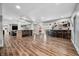 Finished basement with a custom bar, stone columns, durable vinyl flooring, and ample seating at 2688 S Oscar Ct, Morgantown, IN 46160
