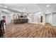 Finished basement with a custom bar, pendant lighting, and durable vinyl flooring at 2688 S Oscar Ct, Morgantown, IN 46160