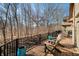 Relaxing deck with patio furniture and views of a wooded landscape, creating a private outdoor oasis at 2688 S Oscar Ct, Morgantown, IN 46160
