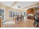 Spacious dining area with a large table, custom desk and bright windows at 2688 S Oscar Ct, Morgantown, IN 46160