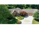 Grand home featuring manicured landscaping, mature trees, and an inviting entrance and driveway at 2688 S Oscar Ct, Morgantown, IN 46160