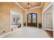Grand foyer with elegant lighting, textured walls, and beautiful double doors at 2688 S Oscar Ct, Morgantown, IN 46160