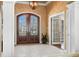 Bright foyer features stone floors, double doors and a view into the living spaces at 2688 S Oscar Ct, Morgantown, IN 46160