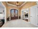 Inviting foyer with stone flooring, a decorative light fixture and french doors at 2688 S Oscar Ct, Morgantown, IN 46160