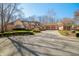 Beautiful brick home featuring an attached three-car garage, inviting curb appeal, and a circular driveway at 2688 S Oscar Ct, Morgantown, IN 46160