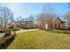 Attractive brick home featuring an attached three-car garage, inviting curb appeal, and mature trees at 2688 S Oscar Ct, Morgantown, IN 46160