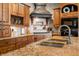 Gourmet kitchen with granite counters, stainless steel appliances, and custom wood cabinetry at 2688 S Oscar Ct, Morgantown, IN 46160