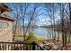 Stunning lake view from the balcony of this brick home, surrounded by trees at 2688 S Oscar Ct, Morgantown, IN 46160