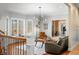 A comfortable living room with a bay window for lots of natural light, contemporary furniture, and hardwood floors at 2688 S Oscar Ct, Morgantown, IN 46160