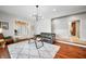 The living room features hardwood floors, a fireplace, neutral paint, and contemporary lighting at 2688 S Oscar Ct, Morgantown, IN 46160